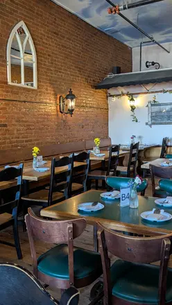 Tables beneath the arched windows