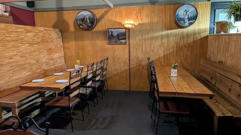 The wood-paneled room set for a party