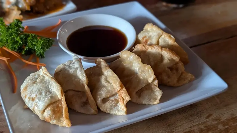 Fried dumplings with a dipping sauce