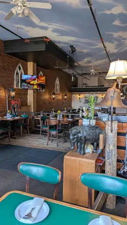 Teal chairs and the dining room beyond