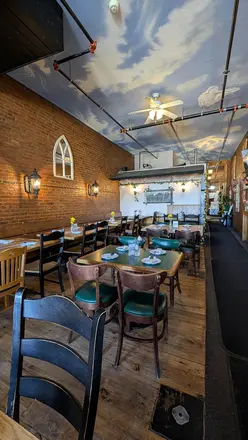 Rows of tables under the painted-sky ceiling