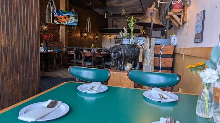 Teal chairs at a table set for dinner