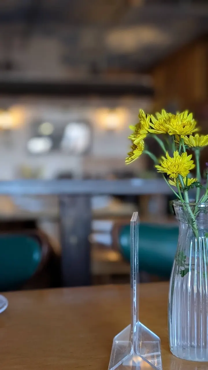 Yellow flowers in a vase on a table